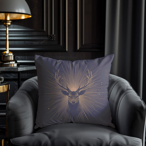 A pillow cover showing a noble stag rendered in shimmering beige against navy blue fabric. Fine beige tan rays extend from the deer's head like sunbeams, with scattered stars.